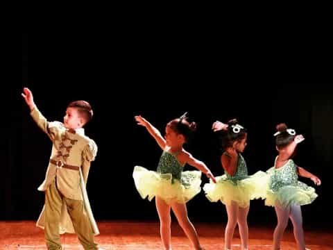 a group of people dancing on a stage