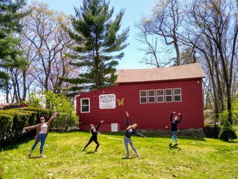 a group of people playing baseball