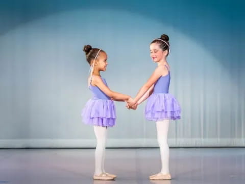 two girls in blue dresses