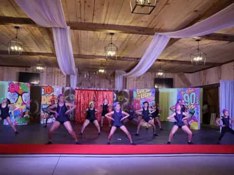 a group of people dancing on a stage