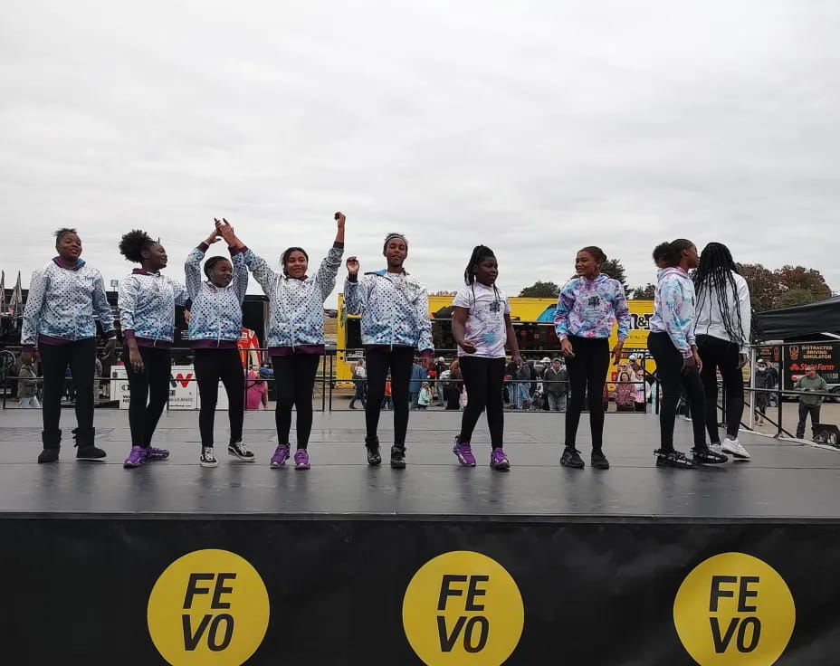 a group of people standing on a stage