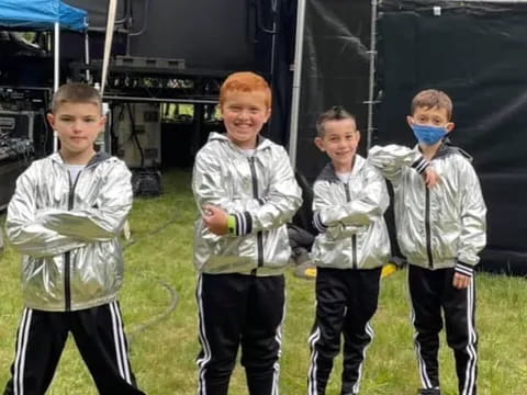 a group of boys wearing face masks