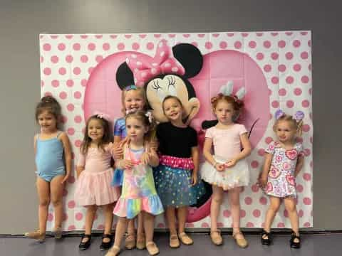 a group of girls posing for a photo