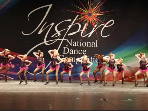 a group of women dancing on a stage