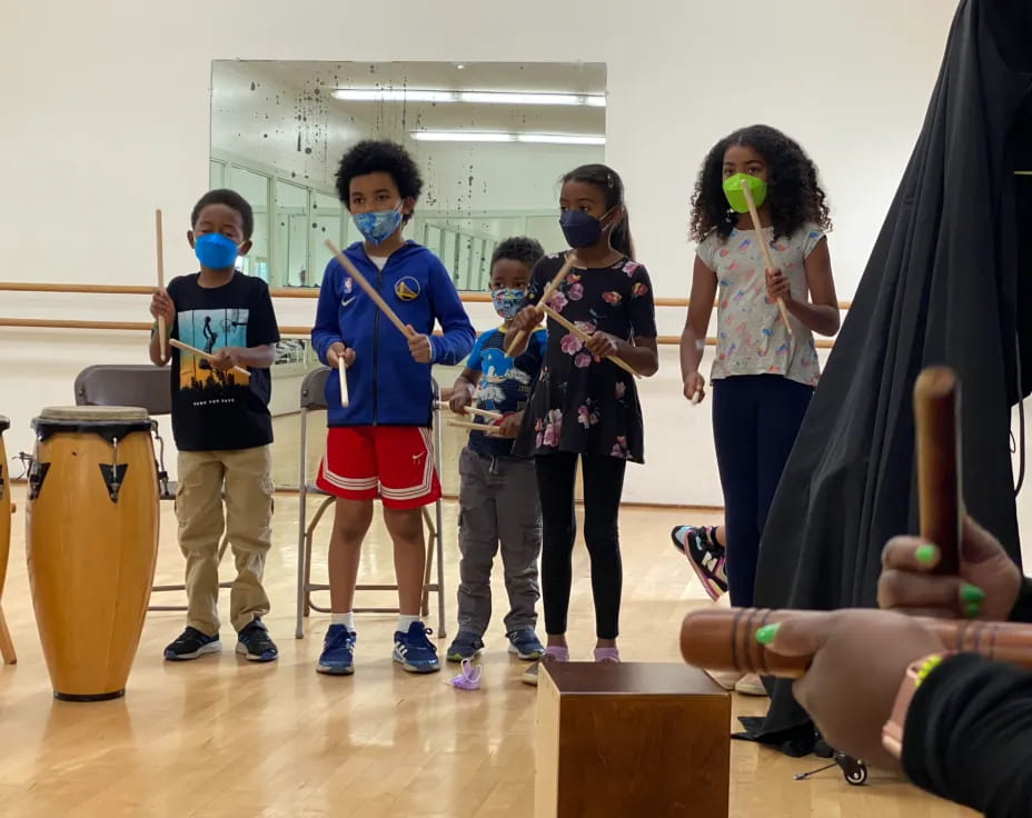 a group of kids wearing masks