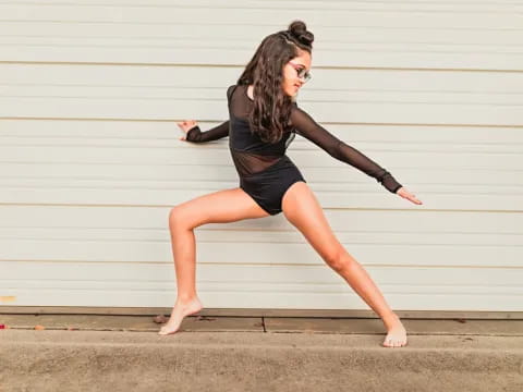 a woman in black dancing