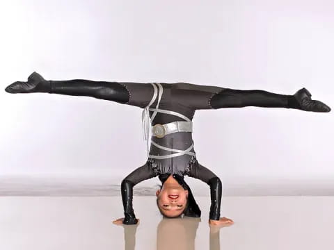 a person doing a handstand