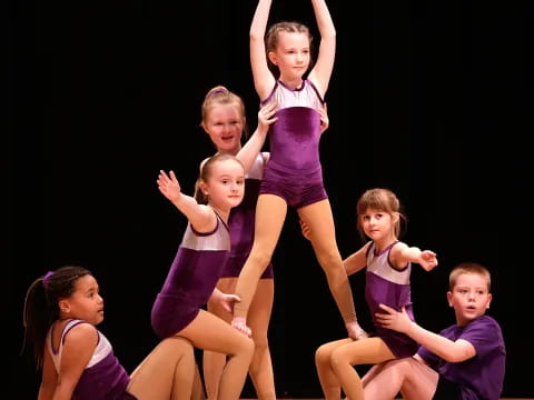 a group of children on a stage