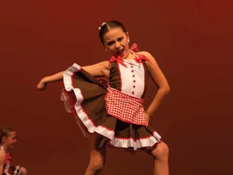 a woman dancing on a stage