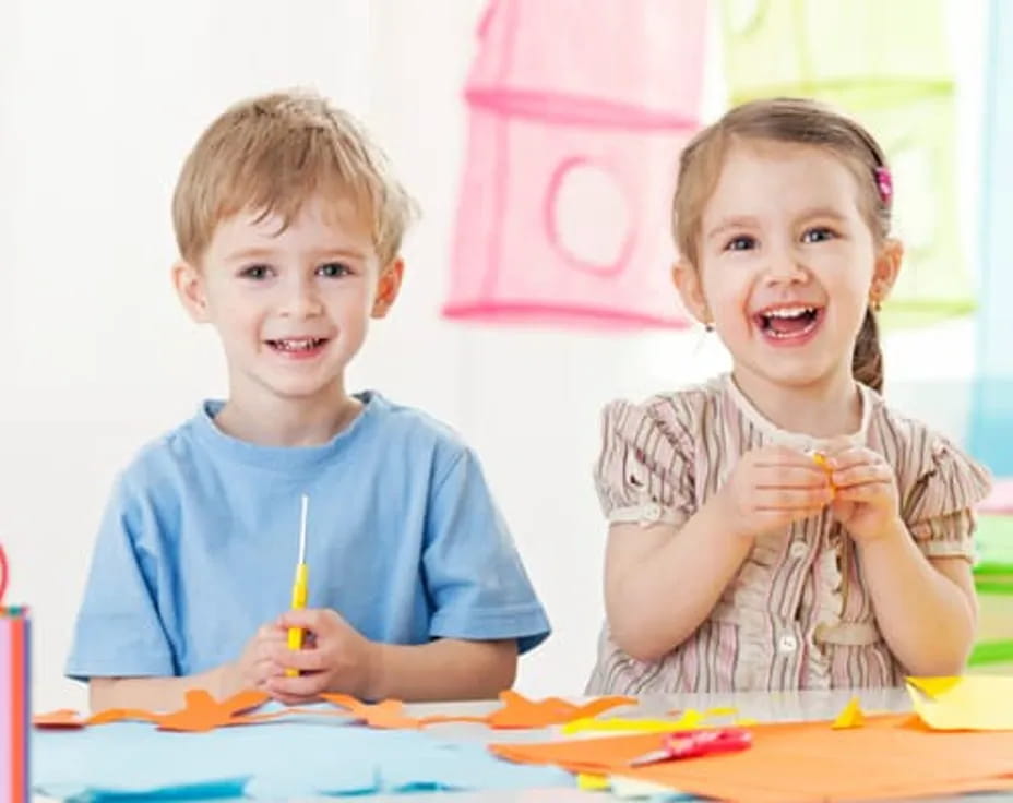 a couple of children smiling