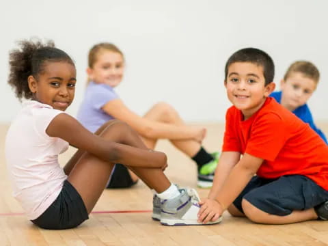 a group of children sitting on the floor