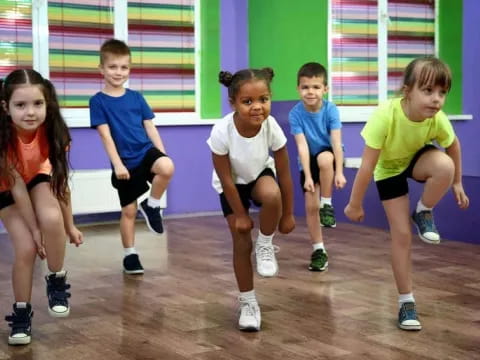 a group of kids in a gym