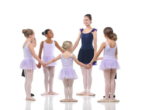 a group of girls in matching outfits