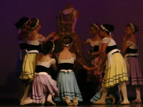 a group of children performing on stage