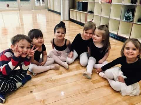 a group of children sitting on the floor