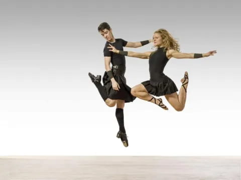 a man and woman jumping in the air