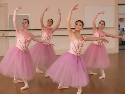 a group of women in dresses dancing