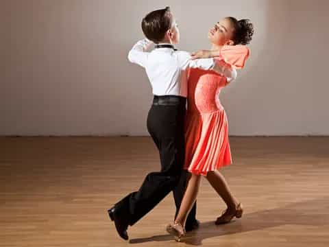 a man and woman dancing