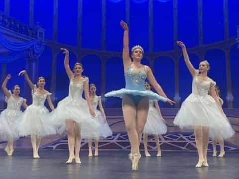 a group of women dancing on a stage