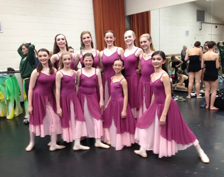 a group of women in dresses