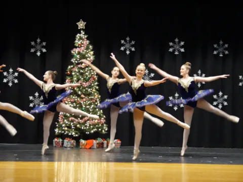 a group of women dancing on a stage