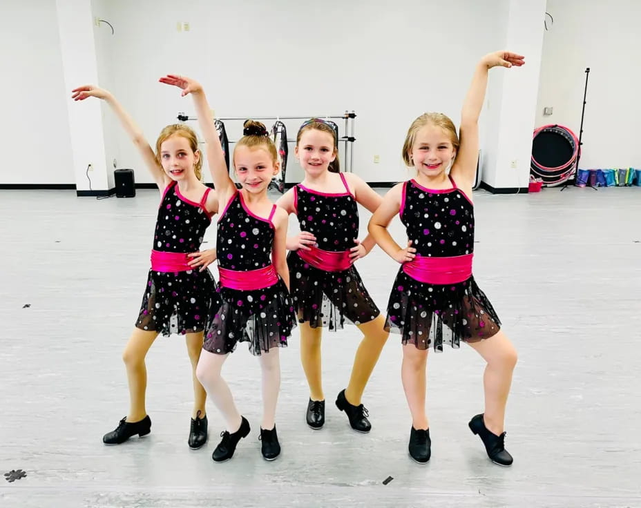 a group of girls posing for a picture