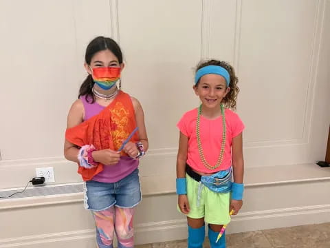 a group of girls wearing clothing