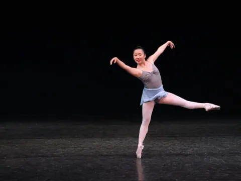 a woman dancing on a stage