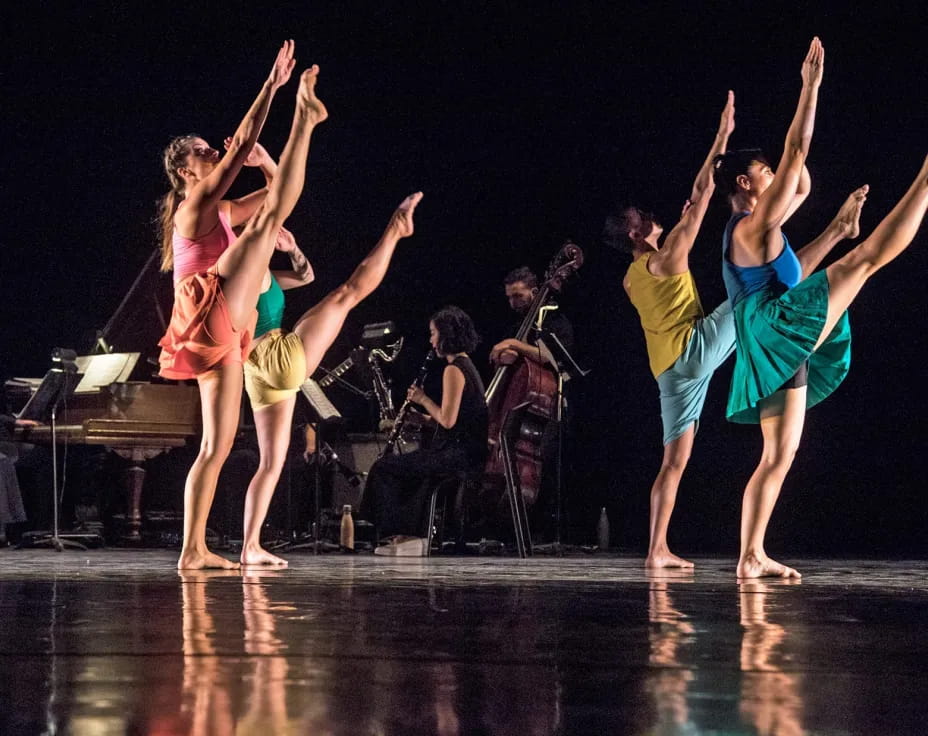 a group of people dancing on a stage