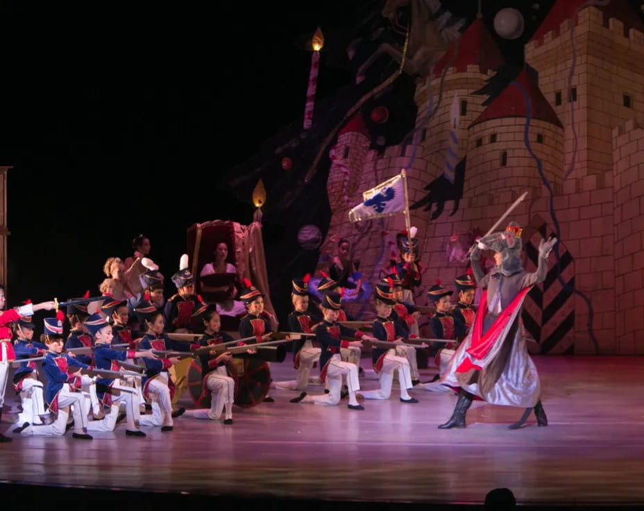a group of people performing on a stage