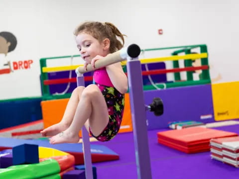 a boy playing on a toy