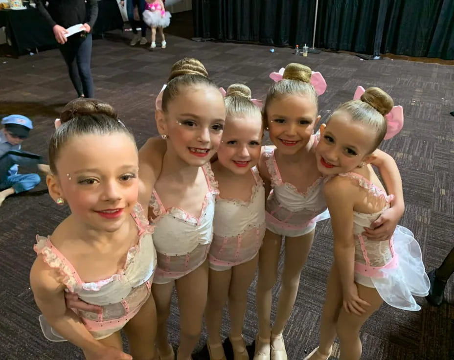 a group of girls wearing clothing