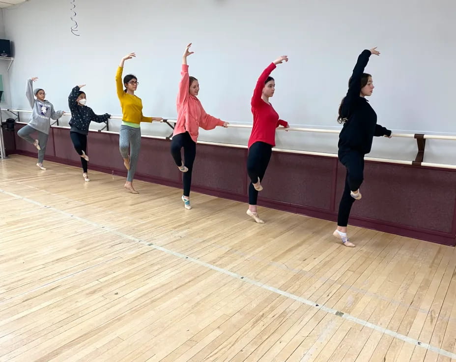 a group of women jumping in the air