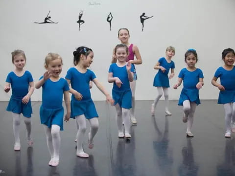 a group of girls in blue uniforms