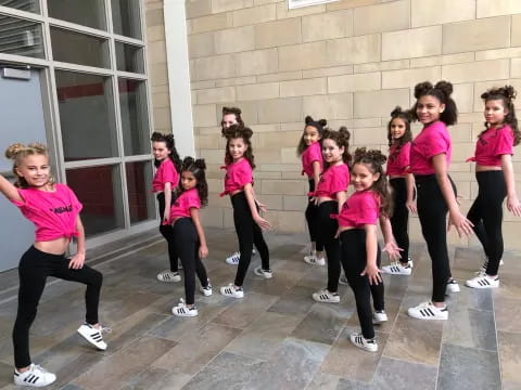 a group of girls posing for a photo