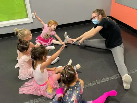 a person teaching a group of children