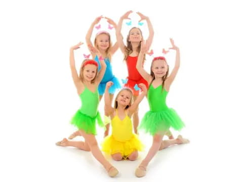 a group of girls in dresses