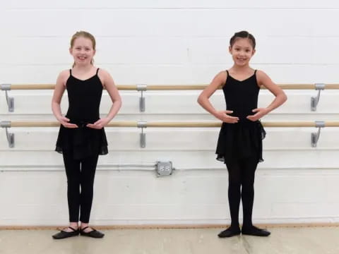 two women in black dresses