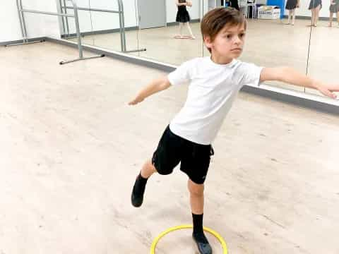 a boy playing frisbee