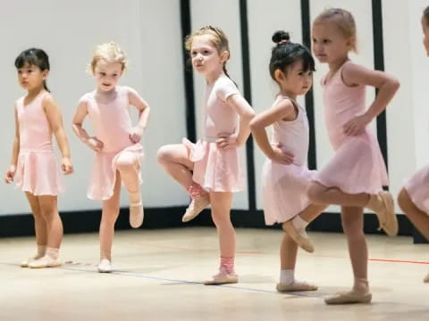 a group of girls in dresses