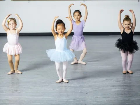 a group of girls in dresses