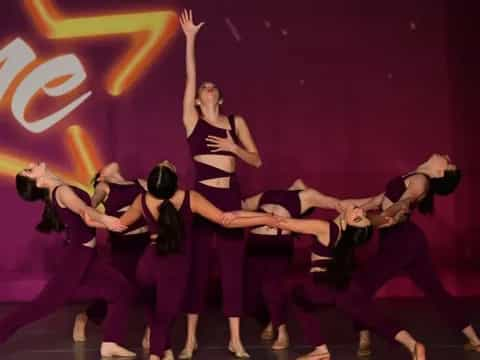 a group of women dancing on a stage