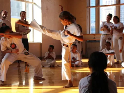 a group of people in karate uniforms