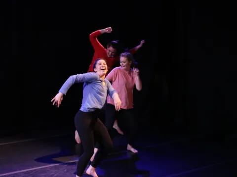 a group of people dancing on a stage