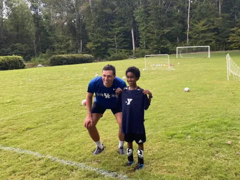 a couple of boys playing football