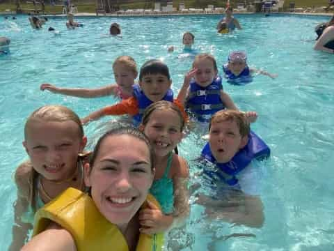 a group of children in a pool