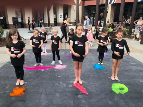 a group of children in black shirts
