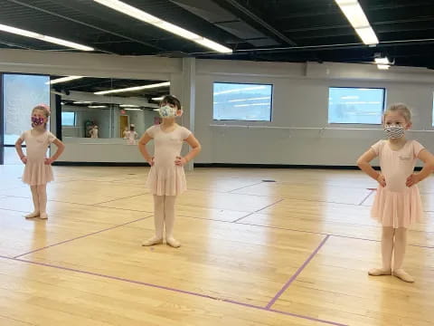 a group of girls wearing masks