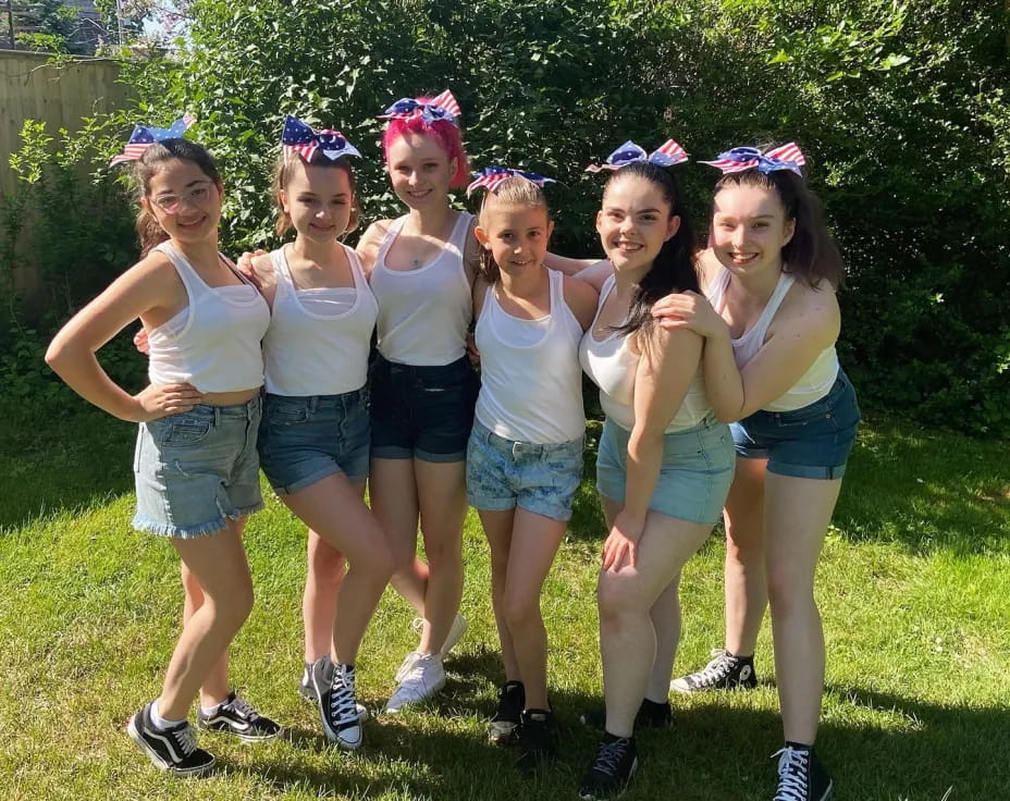 a group of girls posing for a picture