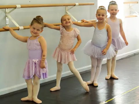 a group of girls in dresses